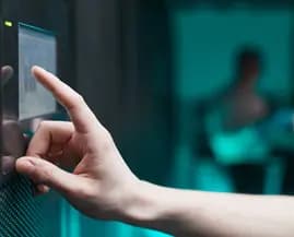 Network engineers checking structured data cabling inside an enterprise server room enclosure