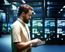 System administrator checking network analytics on a tablet