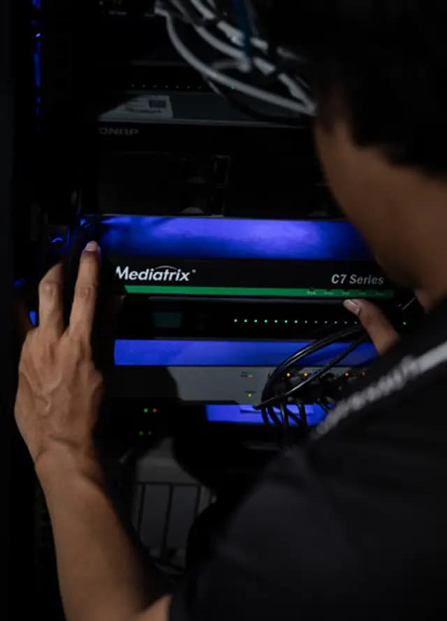 Cybernaut technician configuring a business VoIP phone system